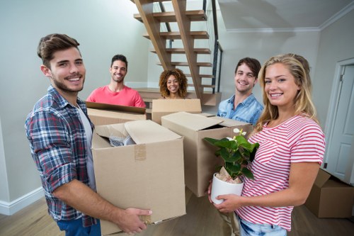 Packed boxes and moving equipment prepared for a Kingsbury relocation