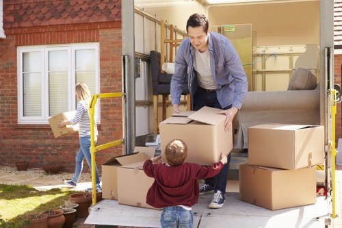 Worker carrying out careful manual handling during a move