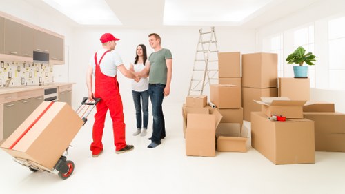 Packed boxes and furniture prepared for transport in Kingsbury