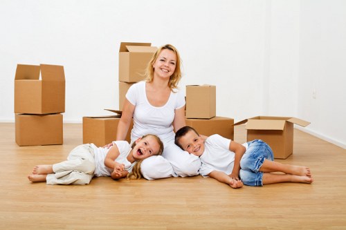 Moving van and packed boxes for a home move in Kingsbury